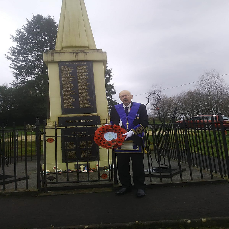 Bro. Iain Robb WSW laying the Lodges wreath at the war memorial for Remembrance Sunday